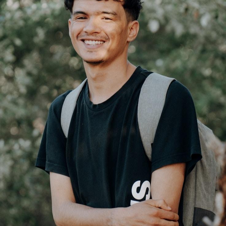 Kaveri Mehta, Lead Design Curator at Paper Grove View, reviewing corporate floral arrangements